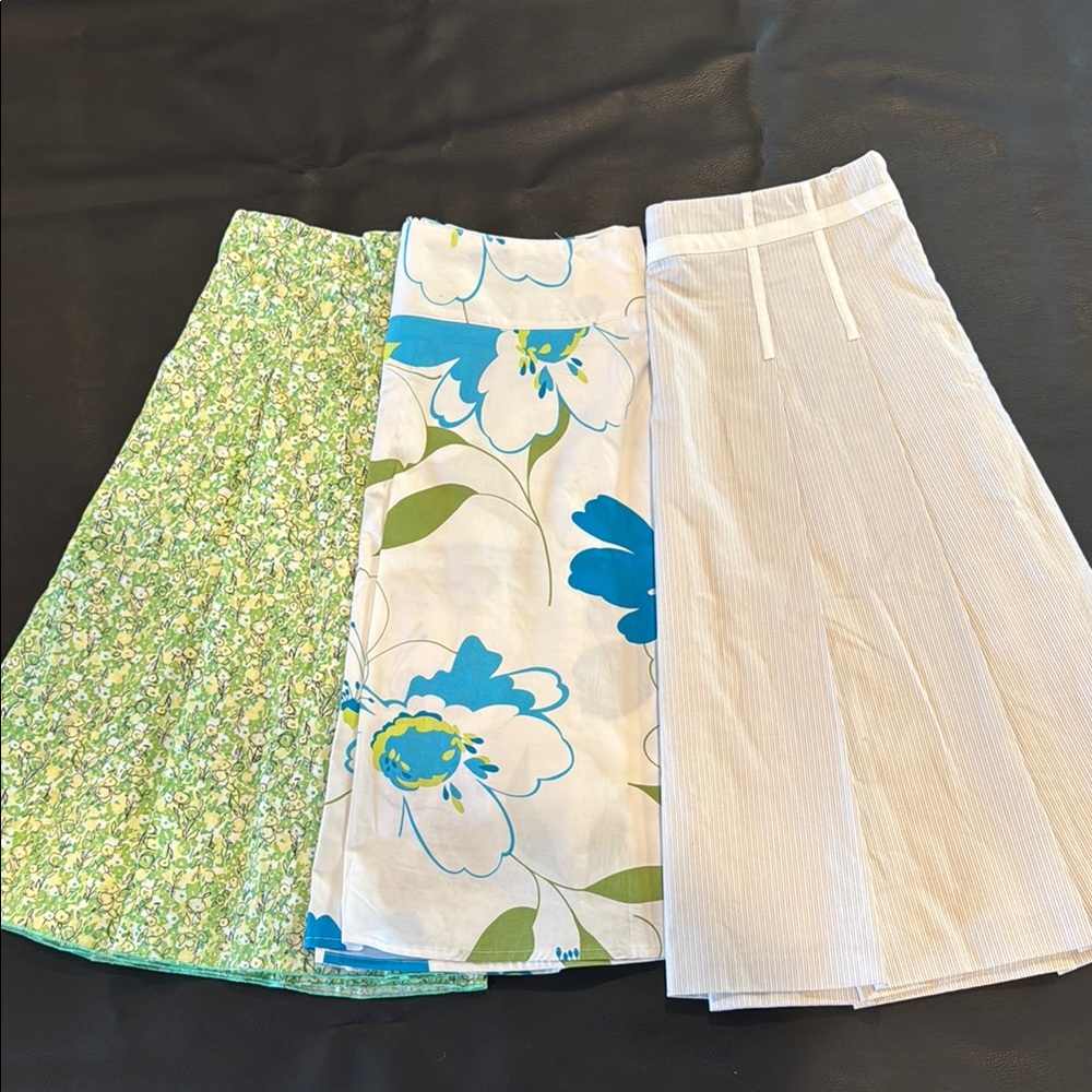 Set of THREE A line skirts-Floral and Striped- women’s size 4 and 5.